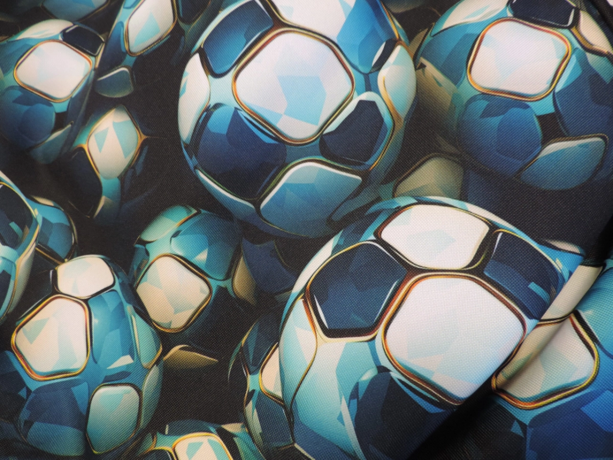 Detail vzoru modrých futbalových lôpt na látke